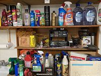Photo of shelf with various cleaning sprays, bleach, insect control, polish bottles and hardware parts