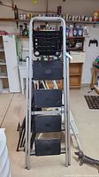 Full view of the 5ft aluminum stepladder showing the four black steps and tool tray at the top