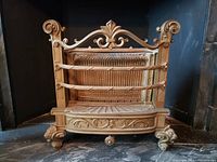 Front view of gold-painted cast radiator showing overall design and dimensions.