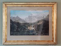 Full view of vintage framed Rocky Mountains print showing mountainous landscape and Native American figures in gold Art Deco frame.