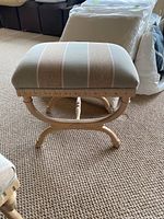 Front view of stool on textured carpet