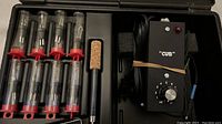 Full view of the Cub wood burning tool control unit with attachments organized in case.