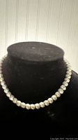 Full view of the faux diamond choker necklace on black display bust showing entire necklace length and style.