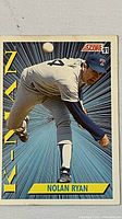 Front of 1991 Score Nolan Ryan baseball card showing pitching action and 'THE K-MAN' text.