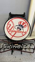 Front view of the circular neon sign showing New York Yankees logo with baseball bat and top hat design, Budweiser neon text below.