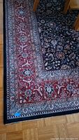 Corner view showing red and cream border with navy field