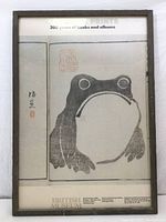 Full view of framed British Museum exhibit poster showing the Japanese woodblock frog print by Matsumoto Hoji