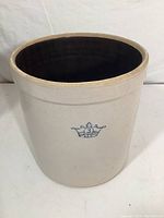 Stoneware crock with crown emblem and number 3 on the side, showing its interior and rim details.