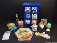 Group photo of all 11 pottery and painted wood decorative items showing variety and condition
