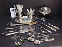 Full lot arranged showing tray with pitchers, spoons, cake servers, carving set and bon bon dish
