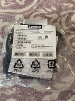 Clear image of the Lenovo DisplayPort to DisplayPort cable packaging label showing model number and product info.