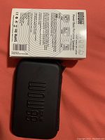 Box of WoWee Power Bass portable speaker showing product branding and specifications.