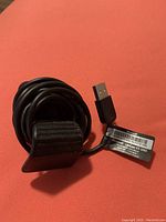 Close-up of the USB plug of the LifeCam VX-3000 with label and serial number visible on cable.