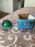 Power Wrist Ball shown next to original box with branding and product name visible
