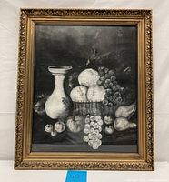Framed monochrome pastel still life of fruits and a vase.
