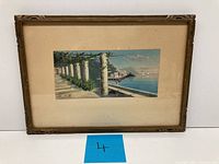Framed pastel drawing of Mediterranean terrace with columns and seascape view, signed by artist.