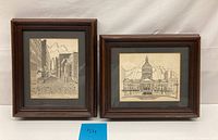 Two framed architectural pencil prints side by side, showing city street and domed building.