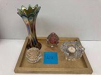 Full view of all four glass items on a wooden tray: carnival glass vase, Waterford crystal paperweight, small perfume bottle, and candle holder with tea light.