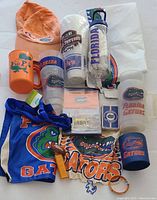 Full lot layout showing all items including apparel, drinkware, lanyard, and collectibles