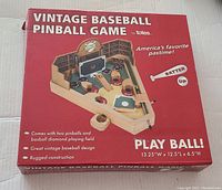 Closed red box packaging of Totes Vintage Baseball Pinball Game showing product image and description on front.