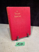 Front cover of the book showing red embossed hardcover with gold title text