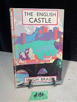 Front cover of the book showing colorful illustrated dust jacket depicting an English castle and bridge with the title and author name.