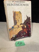 Front cover of Huntingtower book by John Buchan with illustrated dust jacket and visible signs of aging and wear.