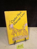 Front cover of vintage book Marriage Lines by Ogden Nash with yellow illustrated dust jacket showing a man and woman cooking
