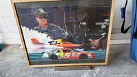 Framed NASCAR poster showing Ricky Rudd in racing gear with Tide sponsorship and race cars.