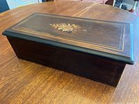 Music box closed, top view showing marquetry inlay motif