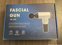 Box of Fascial Gun SK-320 with image and description on front