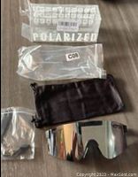 Original sealed packaging labeled polarized for sunglasses.