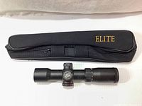 Excalibur Tact Zone crossbow scope alongside Elite carry case on white background, showing full items.