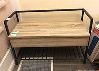 Front view of the metal-framed hall bench showing wood finish top storage and metal lower shoe rack.