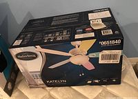 Photo of Harbor Breeze ceiling fan box showing product image, brand, model number and features.