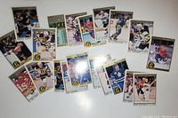 Photo showing all 20 O-Pee-Chee Premier hockey cards in a fanned layout displaying various star players mostly from Original Six NHL teams
