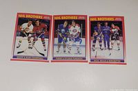 Photo of 3 NHL Brothers hockey cards showing pairs of brothers on each card.
