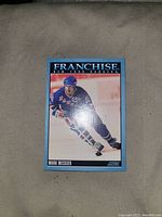 Front view of Mark Messier Franchise hockey card showing player in action and card title.