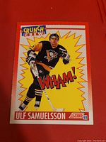 Front of the 1991 Score WHAM! Crunch Crew Ulf Samuelsson hockey card featuring action image and WHAM! graphics