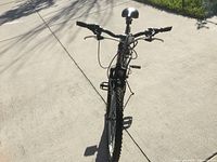 Front view of the PX 6.0 Shimano bicycle showing handlebar, front tire, brake cables, and saddle.