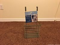 Front view of the Bathworks over door hair care organizer with label visible, showing metal rack design and over door hooks.