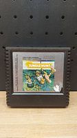 Front view of Jungle Hunt Atari 5200 cartridge showing label artwork and Atari branding.