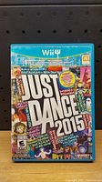 Front cover of Just Dance 2015 game case for Wii U showing title and artwork