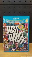 Front view of Just Dance 2015 Wii U game case showing full cover artwork and title.