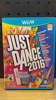 Front cover of the Just Dance 2016 game for Nintendo Wii U showing colorful graphic design.