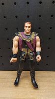 Front view of the 1993 Last Action Hero action figure showing detailed gladiator armor and outfit.