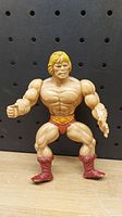 Front view of vintage 1981 He-Man action figure showing muscle details and facial features.