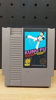 Front view of original Nintendo NES cartridge for Kung Fu game, showing label and overall condition