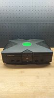 Front view of original Xbox console showing controller ports and buttons