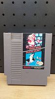 Front view of the NES game cartridge showing the Super Mario Bros. / Duck Hunt label.